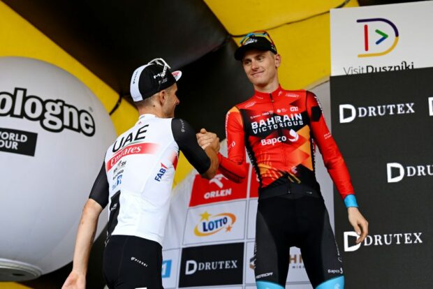 DUSZNIKIZDROJ POLAND JULY 31 The second classified Matej Mohori of Slovenia and Team Bahrain Victorious R and Rafa Majka of Poland and UAE Team Emirates L congratulate each other at podium during the 80th Tour de Pologne 2023 Stage 3 a 1623km stage from Walbrzych to DusznikiZdroj 668m UCIWT on July 31 2023 in DusznikiZdroj Poland Photo by Dario BelingheriGetty Images