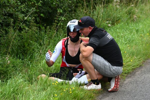 Marlen Reusser sat near the road after suddenly climbing-off during the elite women