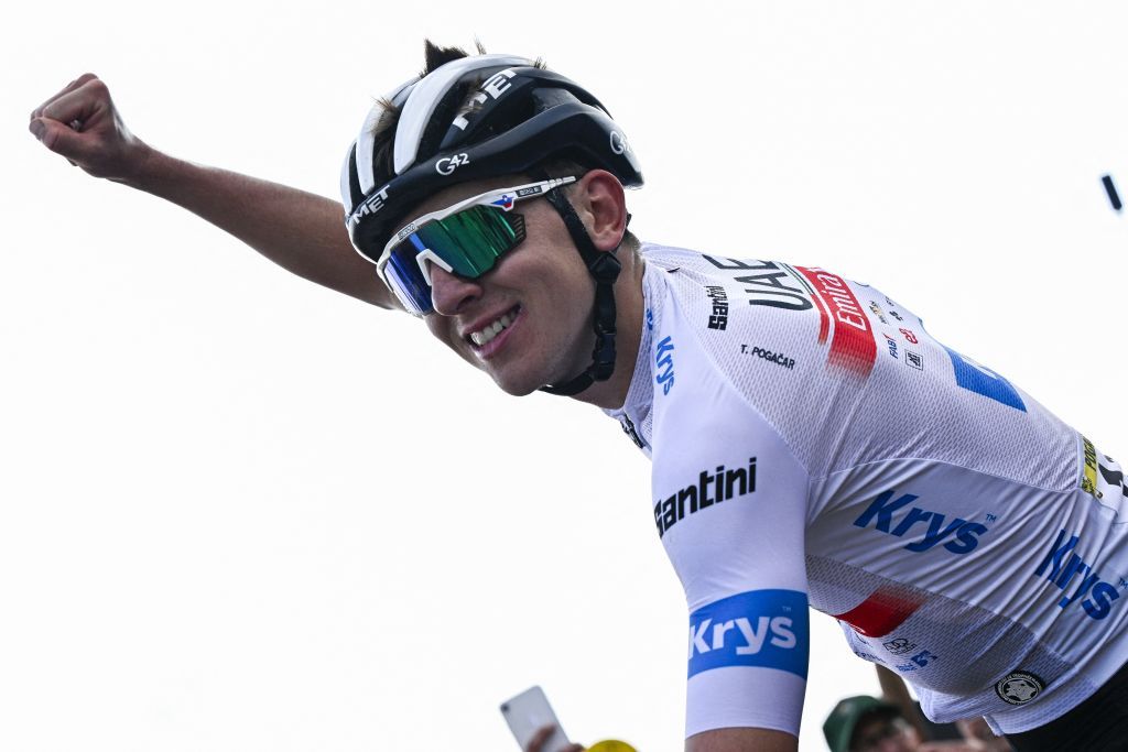 Tadej Pogačar (UAE Team Emirates) celebrates as he crosses the finish line to win stage 20