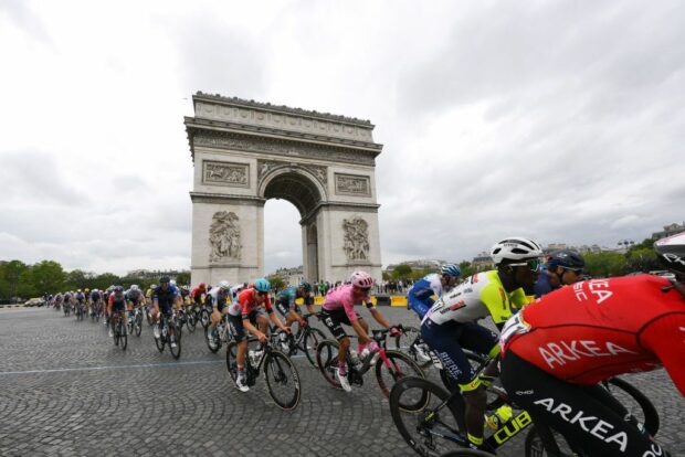 PARIS FRANCE JULY 23 LR Maxim Van Gils of Belgium and Team Lotto Dstny Andrey Amador of Costa Rica and Team EF EducationEasyPost and a general view of the peloton passing close The Arc de Triomf during the stage twentyone of the 110th Tour de France 2023 a 11 51km stage from SaintQuentinenYvelines to Paris UCIWT on July 23 2023 in Paris France Photo by David RamosGetty Images