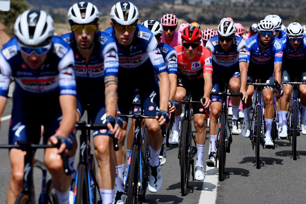 Remco Evenepoel surrounded by his Soudal-QuickStep teammates