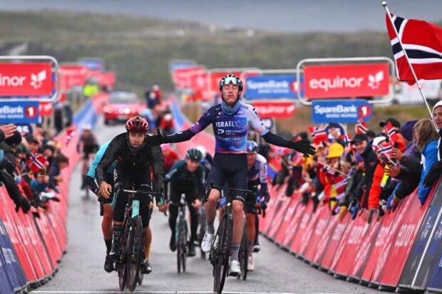 HAVYSUND NORWAY AUGUST 19 Stephen Williams of Great Britain and IsraelPremier Tech R celebrates at finish line as stage winner ahead of Clment Champoussin of France and Team ArkaSamsic L during the 10th Arctic Race of Norway Stage 3 a 167km stage from Hammerfest to Havysund 244m on August 19 2023 in Havysund Norway Photo by Luc ClaessenGetty Images