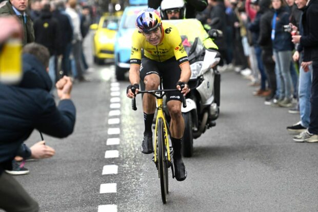 Wout van Aert chases alone behind Mathieu van der Poel during the E3 Saxo Classic