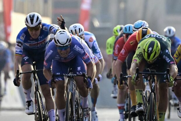 Belgian Jasper De Buyst of Lotto Dstny, Belgian Tim Merlier of Soudal Quick-Step and Dutch Danny van Poppel of Bora-Hansgrohe sprint to the finish of the