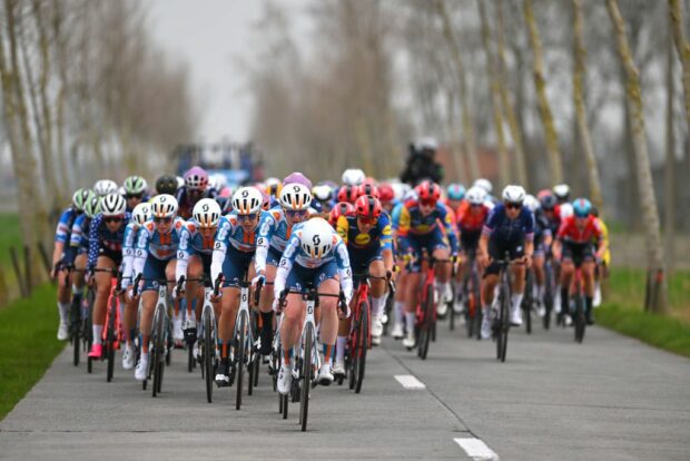 Team dsm firmenich PostNL leads the peloton during Classic Brugge-De Panne