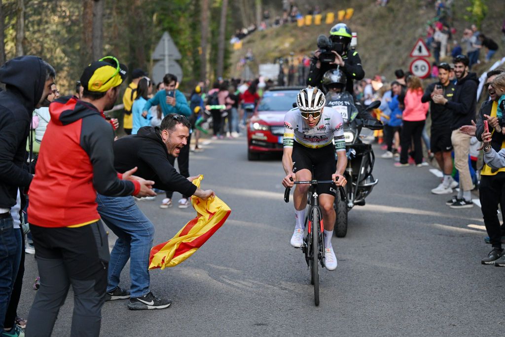 QUERALT SPAIN MARCH 23 Tadej Pogacar of Slovenia and UAE Emirates Team Green Leader Jersey Green Leader Jersey attacks in the breakaway while fans cheers during the 103rd Volta Ciclista a Catalunya 2024 Stage 6 a 1547km stage from Berga to Queralt 1119m UCIWT on March 23 2024 in Queralt Spain Photo by David RamosGetty Images