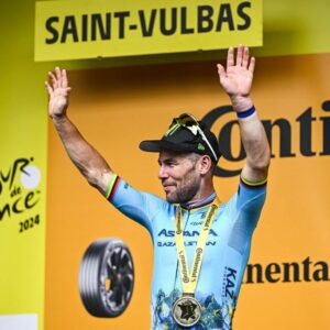 Briton Mark Cavendish of Astana Qazaqstan celebrates on the podium after winning stage 5 of the 2024 Tour de France cycling race, from Saint-Jean-de-Maurienne to Saint-Vulbas, France (177,4 km) on Wednesday 03 July 2024. The 111th edition of the Tour de France starts on Saturday 29 June and will finish in Nice, France on 21 July. BELGA PHOTO JASPER JACOBS (Photo by JASPER JACOBS / BELGA MAG / Belga via AFP)