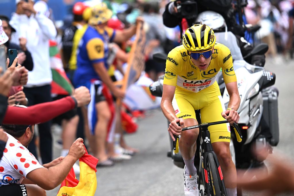 Tadej Pogacar attacks in the breakaway on stage 14 at the Tour de France