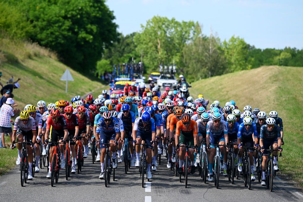 VILLENEUVESURLOT FRANCE JULY 11 LR Nils Politt of Germany and UAE Team Emirates Laurens De Plus of Belgium and Team INEOS Grenadiers Gianni Moscon of Italy and Team Soudal QuickStep Jakob Fuglsang of Denmark and Team Israel Premier Tech Chris JuulJensen of Denmark and Team Jayco AlUla Enric Mas of Spain and Movistar Team and Bart Lemmen of Netherlands and Team Visma Lease a Bike lead the peloton during the 111th Tour de France 2024 Stage 12 a 2036km stage from Aurillac to VilleneuvesurLot UCIWT on July 11 2024 in VilleneuvesurLot France Photo by Dario BelingheriGetty Images