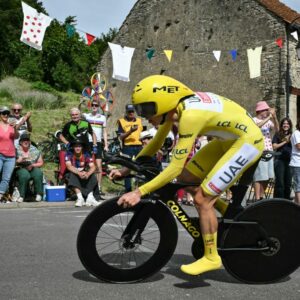 Tadej Pogačar speeds along in the yellow jersey en route to second at the Tour de France stage 7 time trial