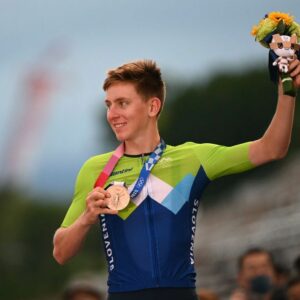 Bronze medallist Slovenias Tadej Pogacar celebrates on the podium during the medal ceremony for the mens cycling road race of the Tokyo 2020 Olympic Games at the Fuji International Speedway in Oyama Japan on July 24 2021 Photo by Greg Baker AFP Photo by GREG BAKERAFP via Getty Images