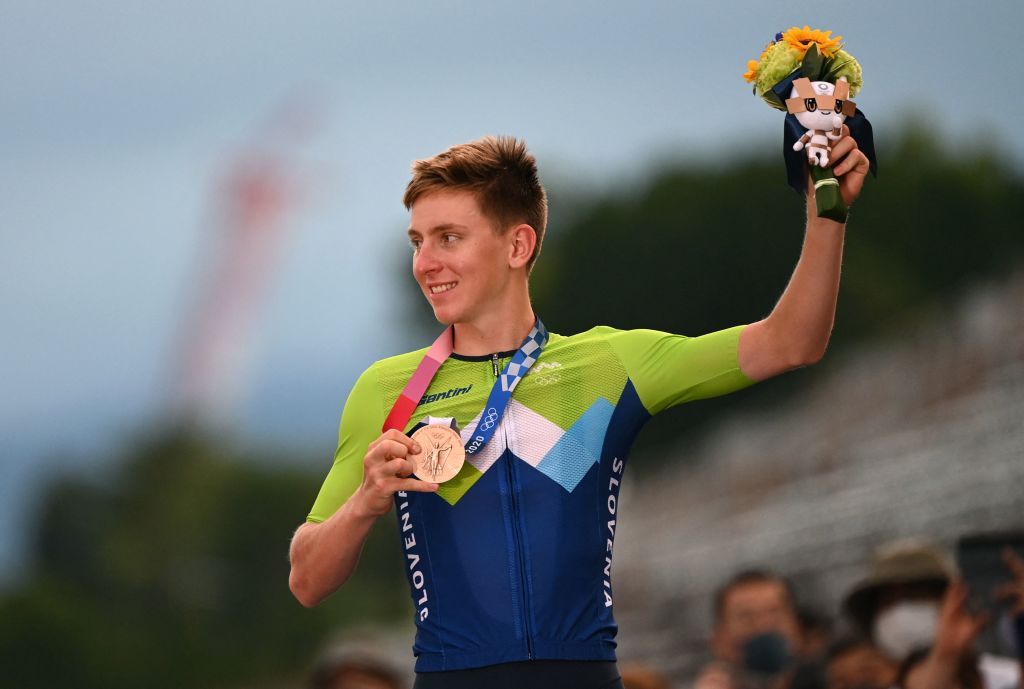 Bronze medallist Slovenias Tadej Pogacar celebrates on the podium during the medal ceremony for the mens cycling road race of the Tokyo 2020 Olympic Games at the Fuji International Speedway in Oyama Japan on July 24 2021 Photo by Greg Baker AFP Photo by GREG BAKERAFP via Getty Images