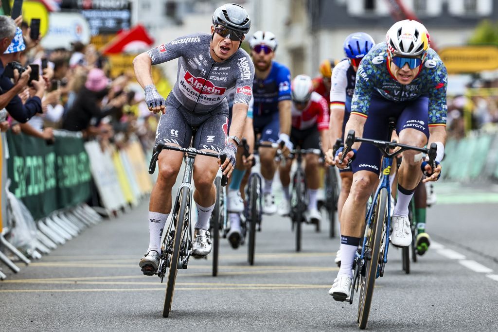 Tour de France 2024 stage 13: Wout van Aert (R) finishes second to Jasper Philipsen (L)