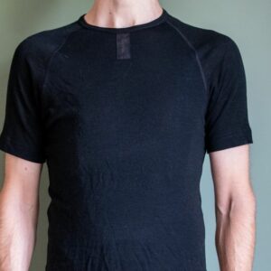 A man wearing the Rapha Merino base layer