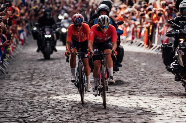 Blanka Vas (Hungary) and Marianne Vos (Netherlands) climb the crowd lined street of the Côte De La Butte Montmartre