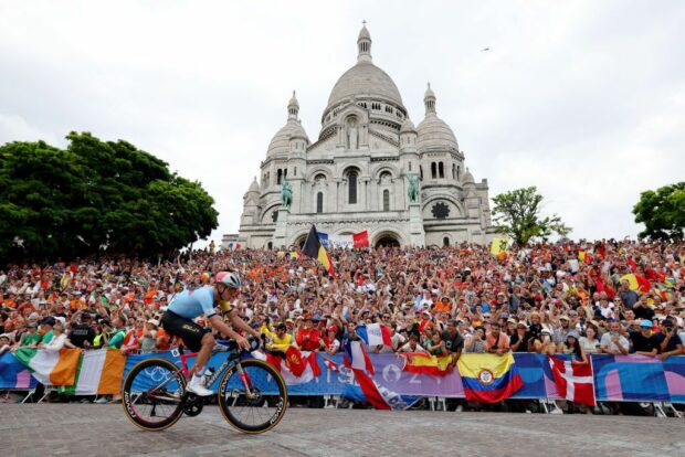 PARIS FRANCE AUGUST 03 Remco Evenepoel of Team Belgium attacks in the breakaway passing by the Basilica of the Sacre Coeur during the Mens Road Race on day eight of the Olympic Games Paris 2024 at trocadero on August 03 2024 in Paris France Photo by Alex BroadwayGetty Images