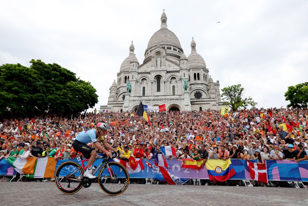 PARIS FRANCE AUGUST 03 Remco Evenepoel of Team Belgium attacks in the breakaway passing by the Basilica of the Sacre Coeur during the Mens Road Race on day eight of the Olympic Games Paris 2024 at trocadero on August 03 2024 in Paris France Photo by Alex BroadwayGetty Images