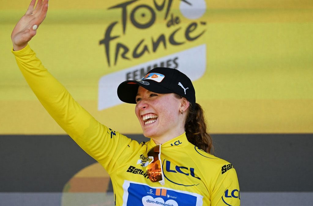 THE HAGUE, NETHERLANDS - AUGUST 12: Charlotte Kool of The Netherlands and Team dsm-firmenich PostNL celebrates at podium as Yellow leader jersey winner during the 3rd Tour de France Femmes 2024, Stage 1 a 123km stage from Rotterdam to The Hague / #UCIWWT / on August 12, 2024 in The Hague, Netherlands. (Photo by Dario Belingheri/Getty Images)