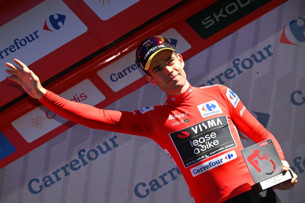 OUREM PORTUGAL AUGUST 18 Wout van Aert of Belgium and Team Visma Lease a Bike celebrates at podium as Red Leader Jersey winner during the 79th La Vuelta Ciclista a Espana 2024 Stage 2 a 194km stage from Cascais to Ourem UCIWT on August 18 2024 in Ourem Portugal Photo by Tim de WaeleGetty Images