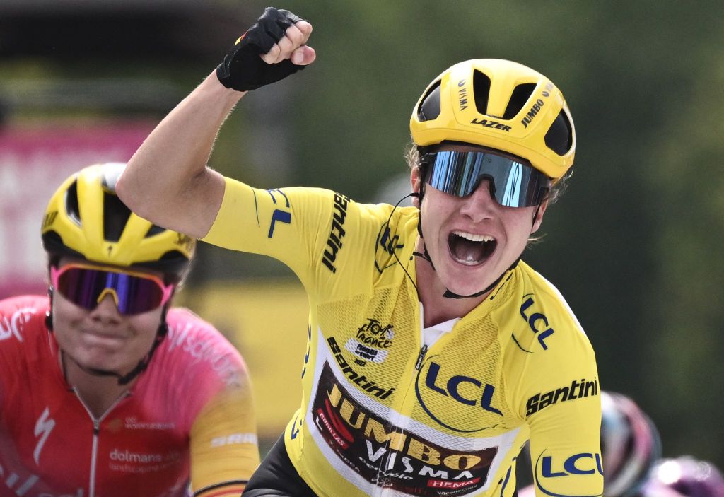 Marianne Vos celebrates a stage win while wearing the Tour de France Femmes leader