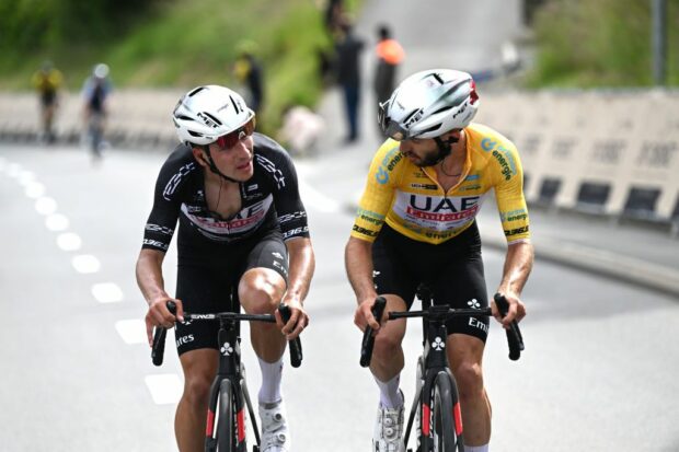 VILLARSSUROLLON SWITZERLAND JUNE 15 LR Joao Almeida of Portugal and UAE Team Emirates Black Points Jersey and Adam Yates of The United Kingdom and UAE Team Emirates Yellow Leader Jersey compete in the breakaway during the 87th Tour de Suisse 2024 Stage 7 a 1182km stage from VillarssurOllon to VillarssurOllon 1248m UCIWT on June 15 2024 in VillarssurOllon Switzerland Photo by Tim de WaeleGetty Images