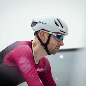 Tom riding in the wind tunnel wearing an aero helmet