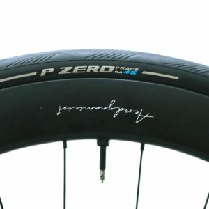 A close up of a black road bike tyre