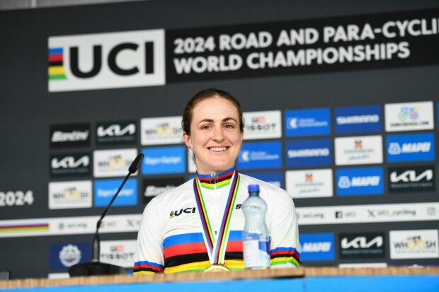 Picture by Ed Sykes/SWpix.com - 22/09/2024 - 2024 UCI Road and Para-cycling Road World Championships, Zurich, Switzerland - Womenâs Elite Individual Time Trial (ITT) Press Conference - Grace Brown (Australia) on the podium receiving the Gold Medal and becoming World Champions