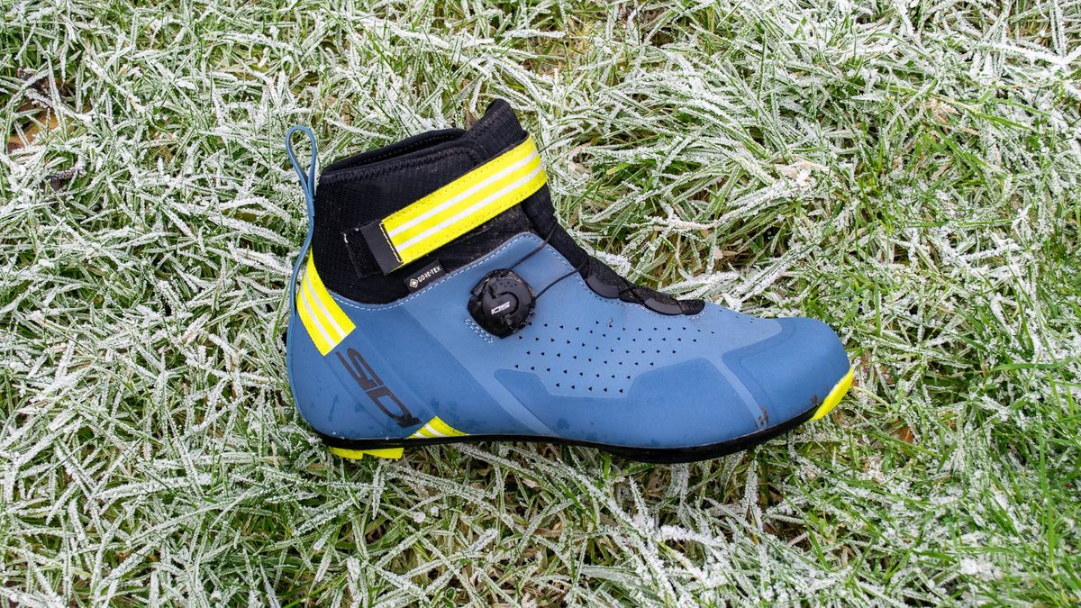 A blue Sidi Nix winter boot on frosty grass