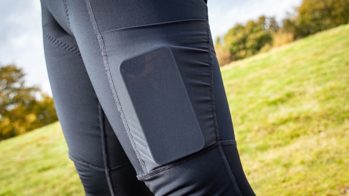 An iphone in the pocket of the POC Thermal Cargo bibtights