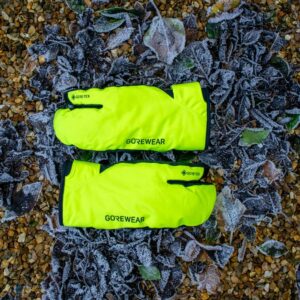 A pair of Gore Wear Trigger gloves on some frosted leaves