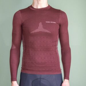 A man wearing the Van Rysel Long Sleeve Racer 2 base layer